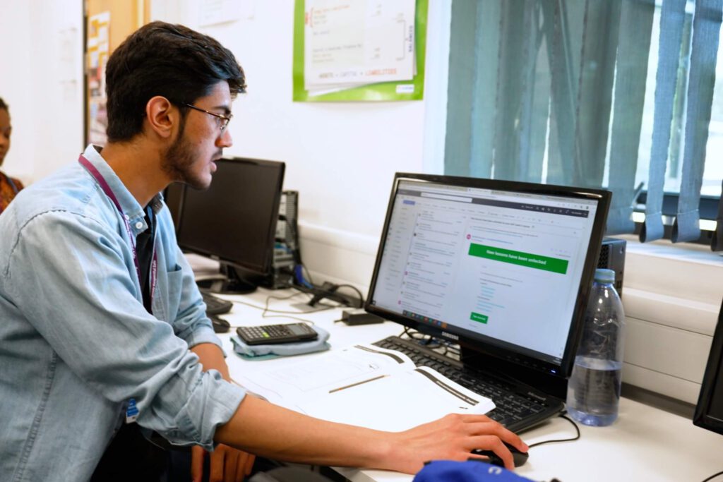 A learner at Westminster Adult Education Service opening an email to set up his account on the Mindful Education Virtual Learning Environment.