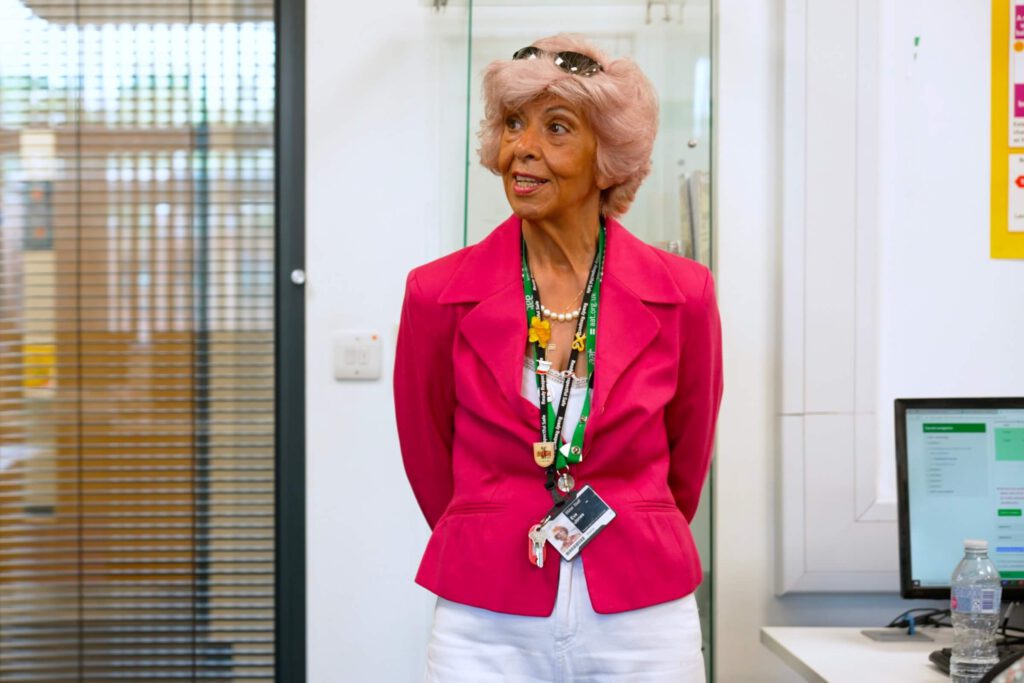 Image of a tutor from Birmingham Metropolitan College standing in front of a class.