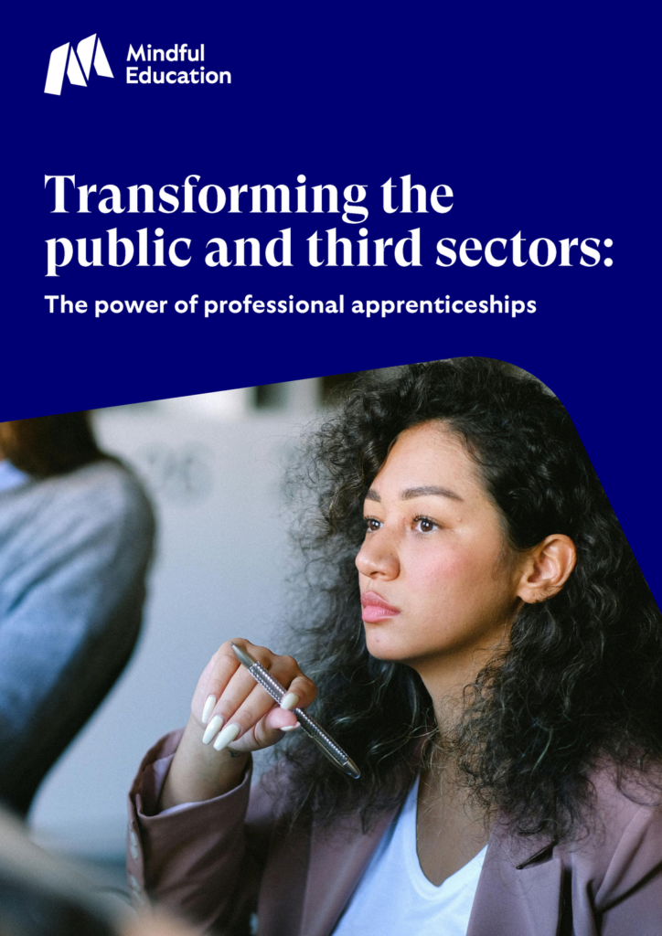 Cover image of the Mindful Education thought piece titled 'Transforming the public and third sectors: The power of professional apprenticeships.' The cover image features a professional individual holding a pen symbolising a corporate environment.