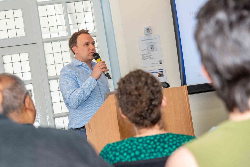 Image of the Managing Director of Mindful Education presenting to Mindful Education employees at the annual Summer Conference.