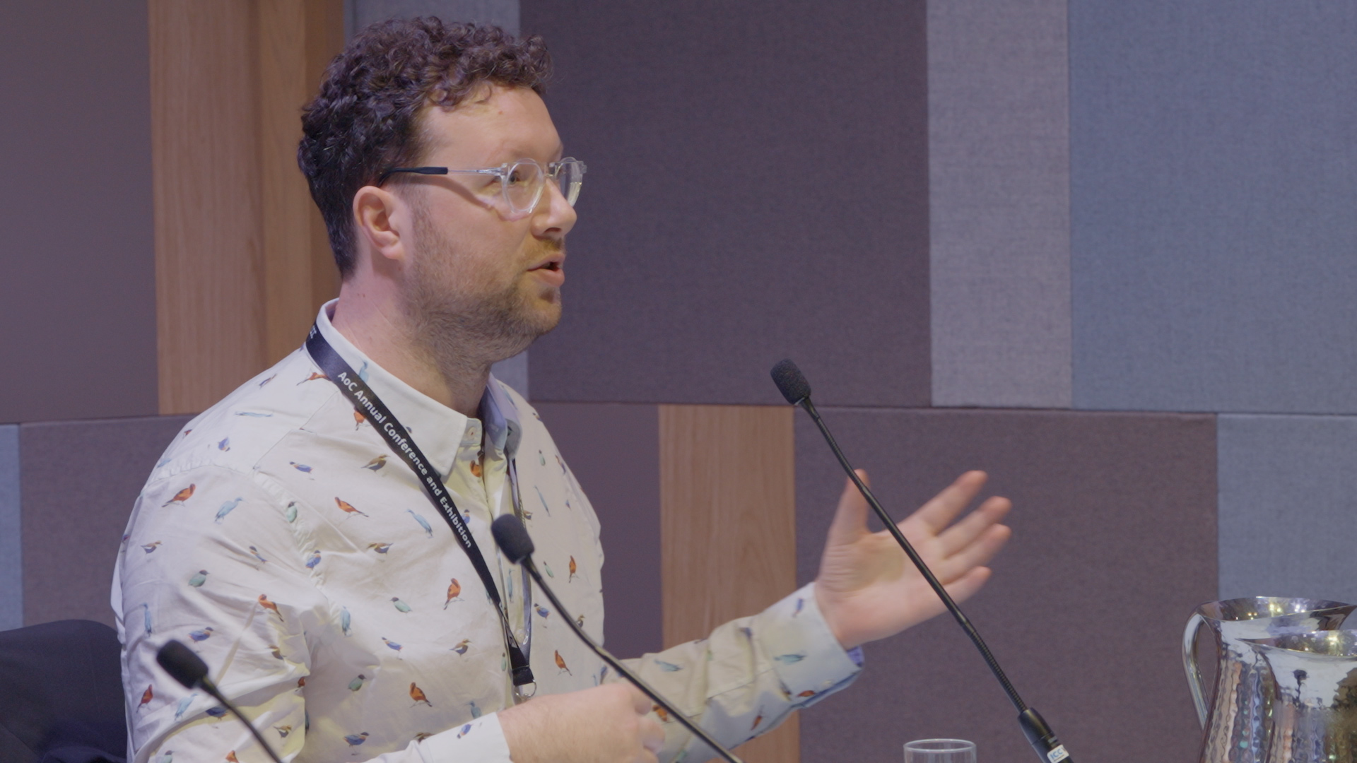 Image of an industry leader speaking to a crowd of people at the AoC Annual Conference.