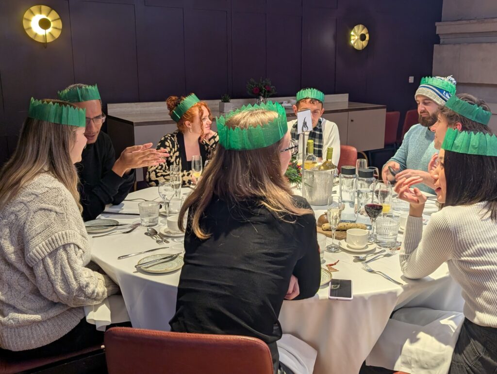 Mindful Education employees conversing with one another at a company function.