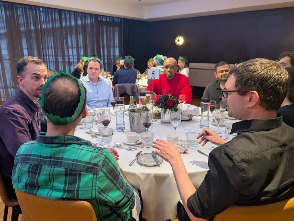 Mindful Education employees conversing with one another at a company function.