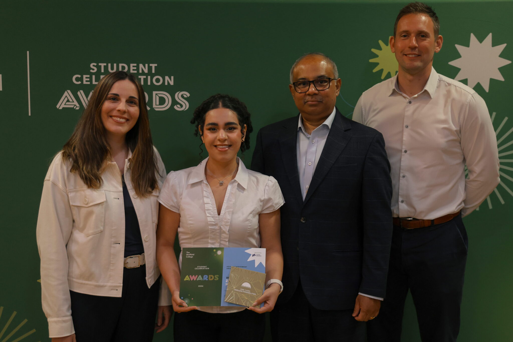 An image of Mindful Education employees with a learner who has won a student award