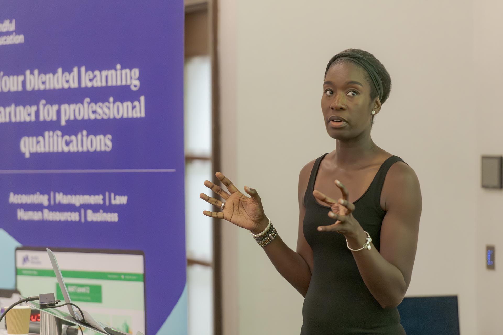 An image of a senior accounting professional presenting at a Mindful Education company conference