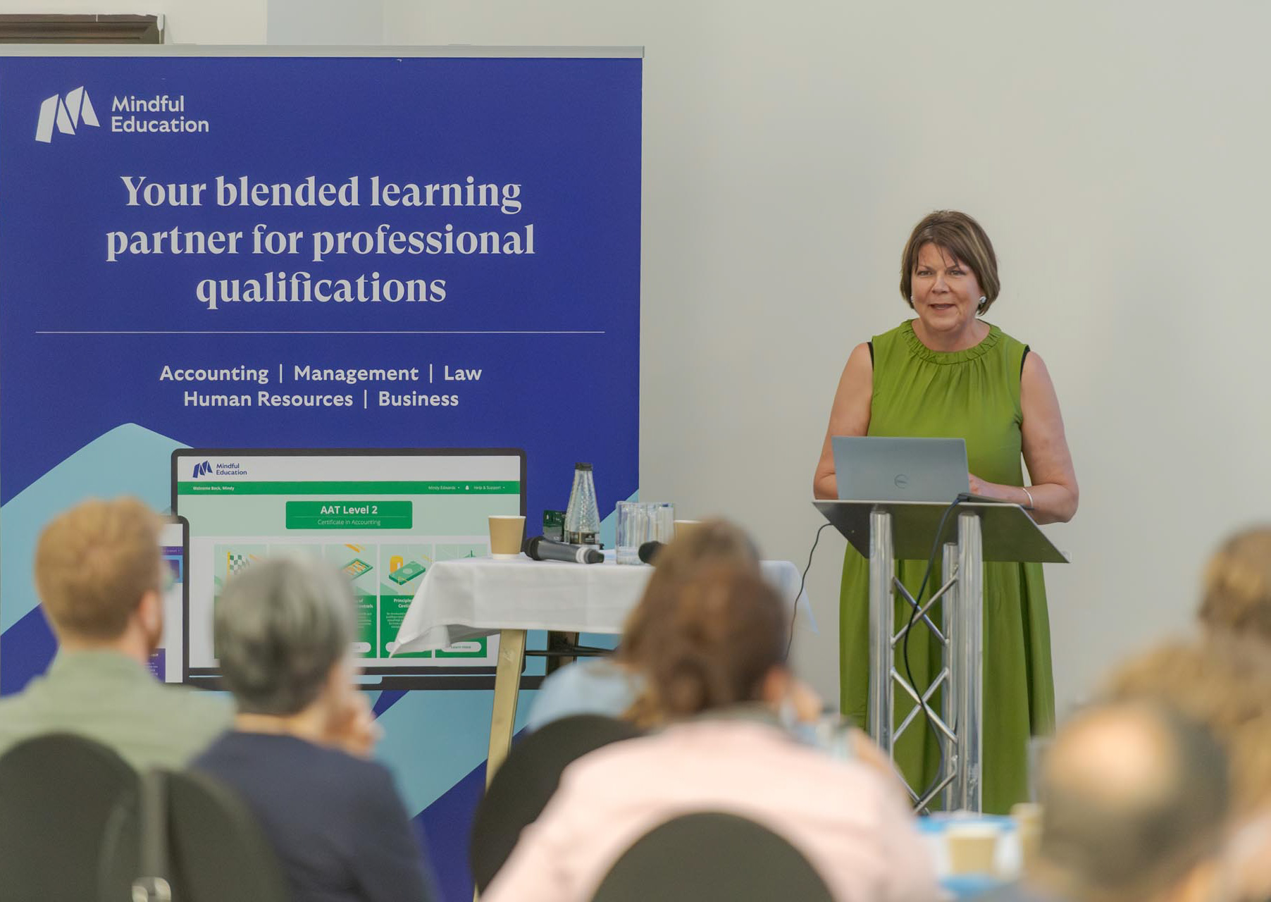 A member of Mindful Education presenting at in front of other Mindful Education employees