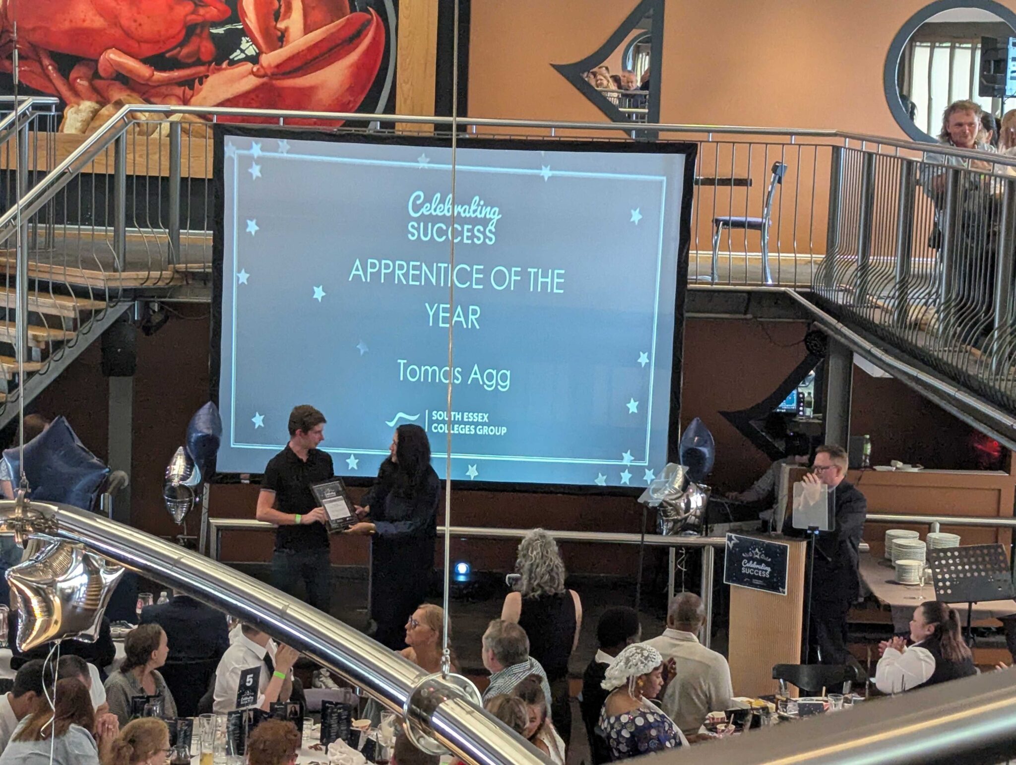 An image showing the apprentice of the Year winner at South Essex College receiving his award